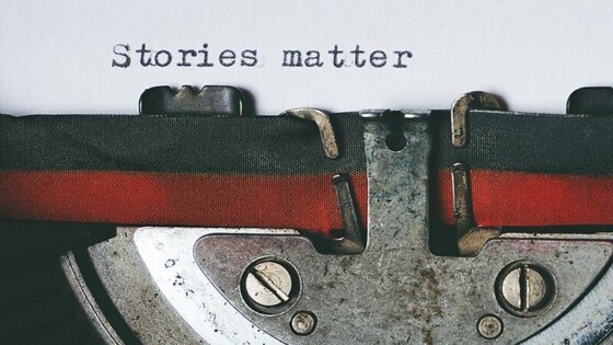 A sheet of paper in a typewriter that reads Stories Matter