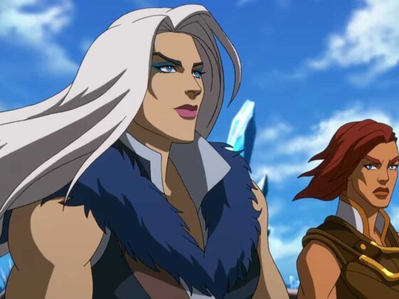 Evil-Lyn has long white hair blowing in the wind with Teela behind her