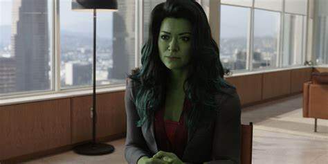 She-Hulk sitting at a desk in lawyer outfit